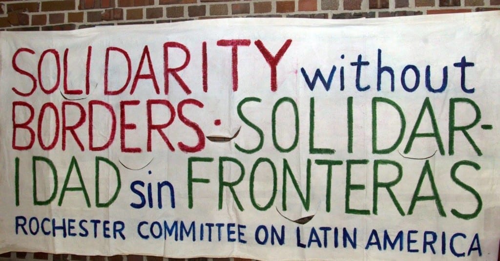 Photo of sign on wall - Solidarity without borders - solidaridad sin fronteras - Rochester Committee on Latin America