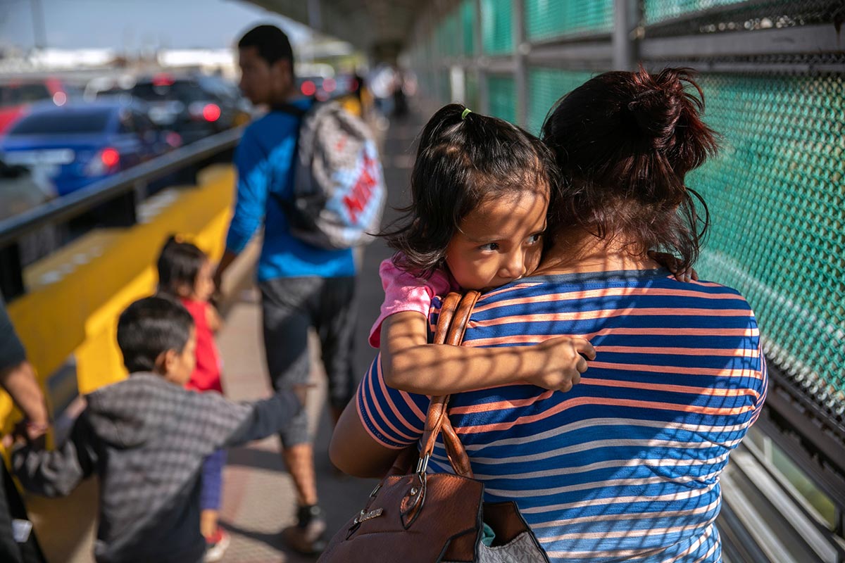 Asylum seeker holding child
