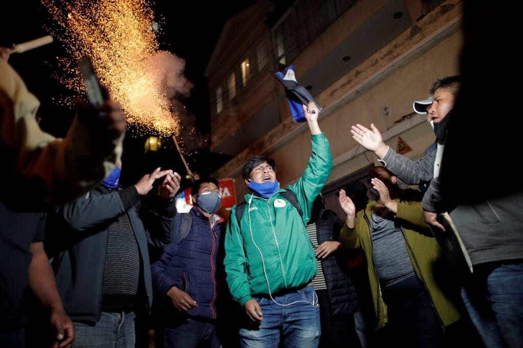 Supporters of President-elect Luis Arce celebrate his victory in front of his house in La Paz, Bolivia, October 23, 2020.