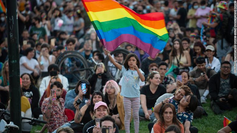 Chilean girl waving rainbow flag