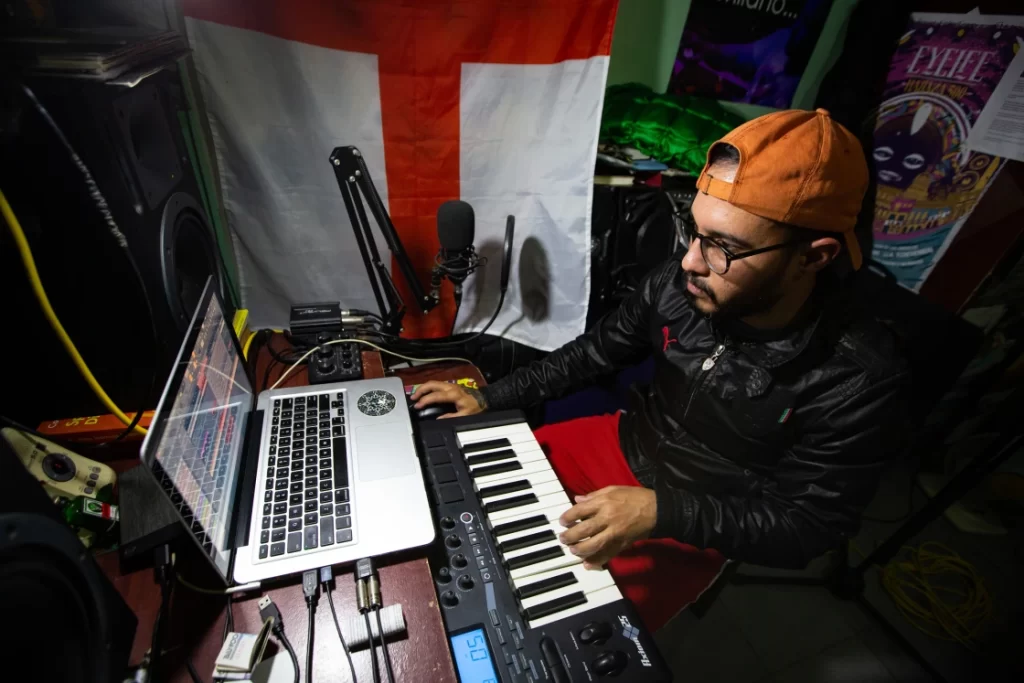 Leonardo Milanes, aka DJ Milano, 33, an electronic music producer, in his home studio.Roberto León / NBC News