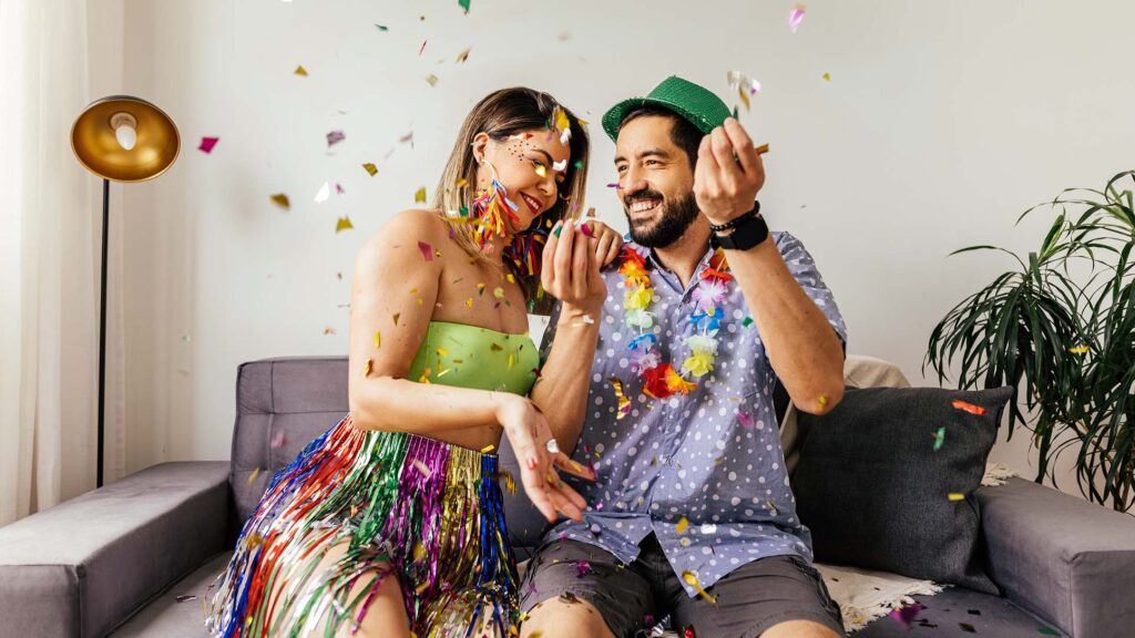 A couple celebrating carnival at home