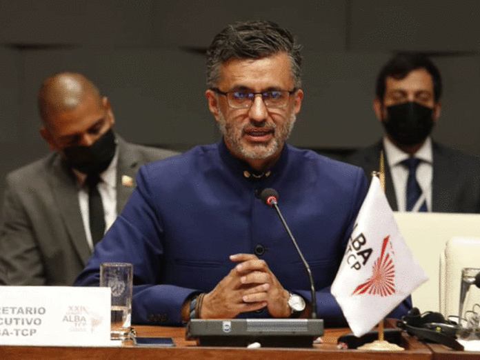 Llorenti sitting at table